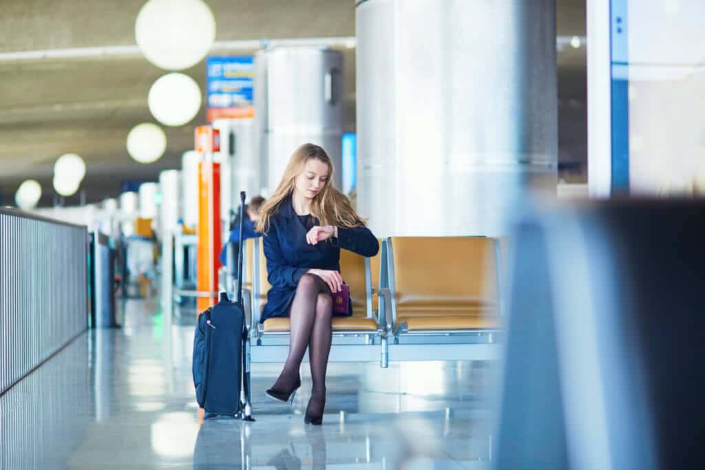 http://www.dreamstime.com/stock-image-young-female-traveler-international-airport-woman-waiting-her-flight-checking-her-watch-looking-upset-worried-missed-image69118821